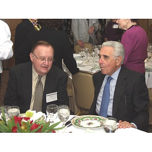 Barry Karger, left, and John Hatsopoulos sitting together at gala dinner