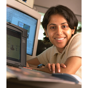 Co-op student surrounded by computers