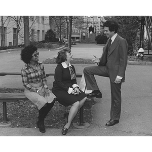 Three students chat on Northeastern's campus