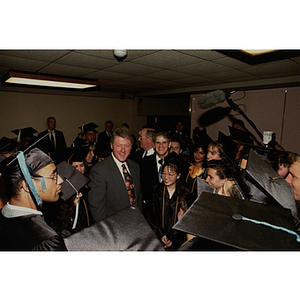 President Bill Clinton standing with Northeastern President John Curry and graduates before 1993 commencement ceremony