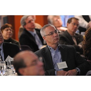 Bob Blanchette listening to a speaker at the Holocaust Awareness Breakfast