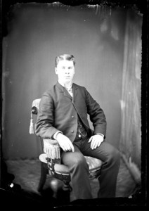 Full portrait of a man, seated