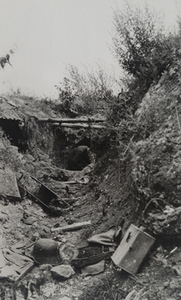 View of an abandoned German trench littered with military debris