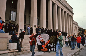 Demonstrators walk past the Pentagon