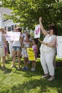 Young girls and families with signs at the pro-immigration rally in front of the Chatham town offices building : taken at the 'Families Belong Together' protest against the Trump administration's immigration policies