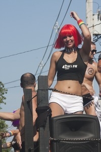 42 Below vodka float, with young woman in skimpy outfits : Provincetown Carnival parade