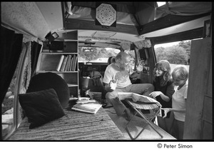 Ram Dass in his van, talking to Ronni Simon and an unidentified woman