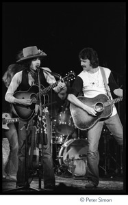 Bob Dylan (left) and Bob Neuwirth performing at the Harvard Square Theater, Cambridge, with the Rolling Thunder Revue