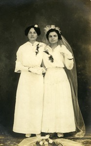 Polish American bride and bridesmaid, Weronika Skedzielewska (bridesmaid) and unidentified bride (l. to r.): full-length studio portrait