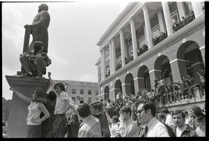 Demonstration at State House against the killings at Kent State: protesters on State House steps applauding and raising fists