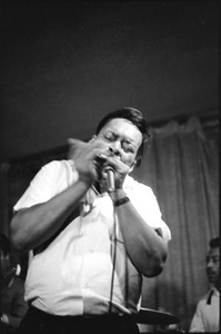 James Cotton at Club 47: James Cotton playing harmonica onstage, with guitarist Luther Tucker at left, and drummer Francis Clay at right
