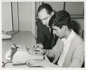 An instructor and trainee at TOWER clerical training