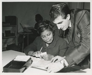 An instructor and trainee at TOWER clerical training