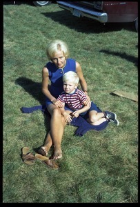 Woman and child, seated on the grass, Pine Beach