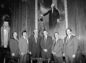 Congressman John W. Olver (3d from left) with visitors to the capitol, standing in front of a portait of George Washington
