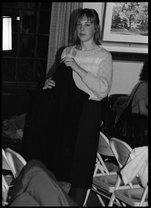 Audience member with her coat at the 10th anniversary celebrations for Women's Studies at UMass Amherst