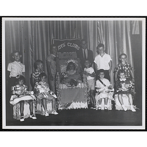 Group portrait of the Little Sister Contest winners with their brothers and two judges, including Richard Harte, Jr., standing at right