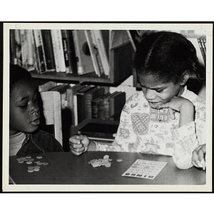 Children play bingo in a library