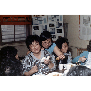 Guests eating at an International Women's Day event