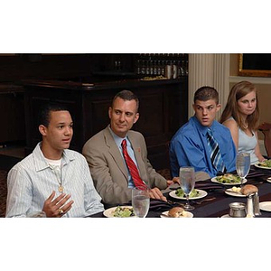 Four people at the Torch Scholars Manganaro Luncheon