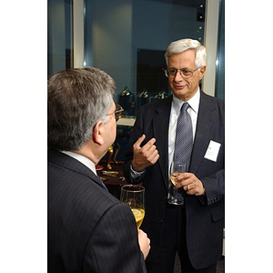 George Chryssis speaks with another guest at The National Council Dinner