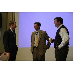 A student and two alumni converse at the Training Future Innovators Entrepreneurs Panel