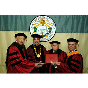 George Kostas posing with his honorary degree