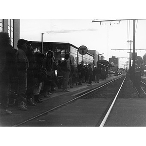 Commuters waiting at the Northeastern University stop on the Green Line