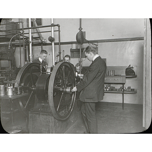 Mechanical engineering students work on a machine