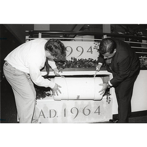 The time capsule being deposited during the Ell Center dedication