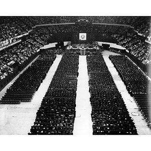 Aerial view of graduates and audience during the commencement ceremony, 1965