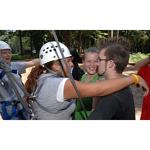 Two students hug at the Torch Scholars Project Adventure Ropes Course