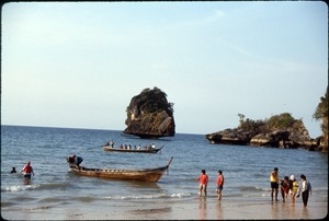 Pedestrians, swimmers, and boats at Princess Cove, Phra Nang Bay, Southern Thailand