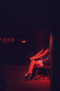Woman bathed in red light