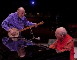 Pete Seeger talking with George Wein (on piano) at the Power of Song Award concert, Symphony Space, New York City