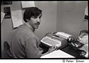 Boston University News staff member Elliot Blinder at the typewriter