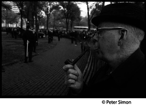 Older man smoking a pipe at George Wallace rally on Boston Common