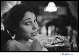 Unidentified woman, with plate and fork