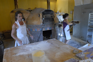 Hungry Ghost Bread: owners and bakers Jonathan C. Stevens and Cheryl Maffei at work near the bakery oven