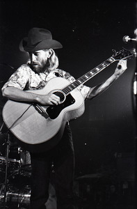 New Riders of the Purple Sage opening for the Grateful Dead at Sargent Gym, Boston University: John 'Marmaduke' Dawson tuning acoustic guitar