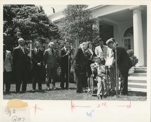 President Gerald Ford handing the handicapped american of the year award to Bill Kiser