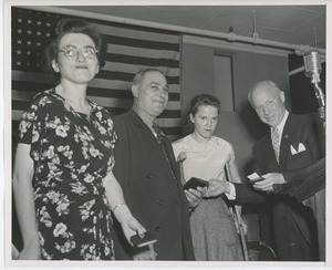 Four unidentified people at graduation exercises