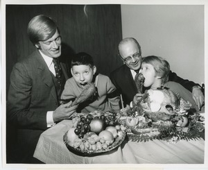 Actor Ken Hooper and Dr. Salvatore G. DiMichael with two young clients at Thanksgiving celebration