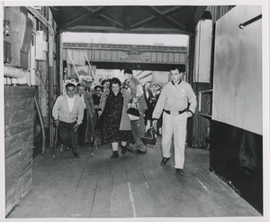 People preparing to board boat