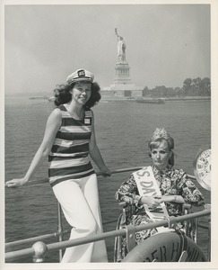 Mrs. Day in the sun on bridge of ship