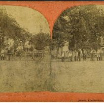 Men pulling cart on Pleasant St