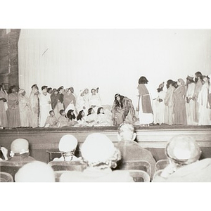 Group of children perform on stage