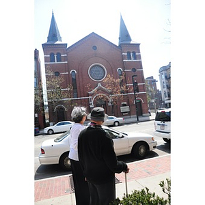 Reverend Chauncy Moore and Lolita Parker, Jr. walking on Columbus Avenue