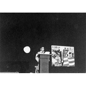 Boy at a podium addressing an audience during an event organized by Inquilinos Boricuas en Acción's Teen and Kid Empowerment Program.
