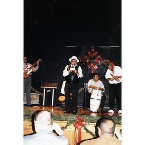 Musicians performing on stage at the Jorge Hernandez Cultural Center.